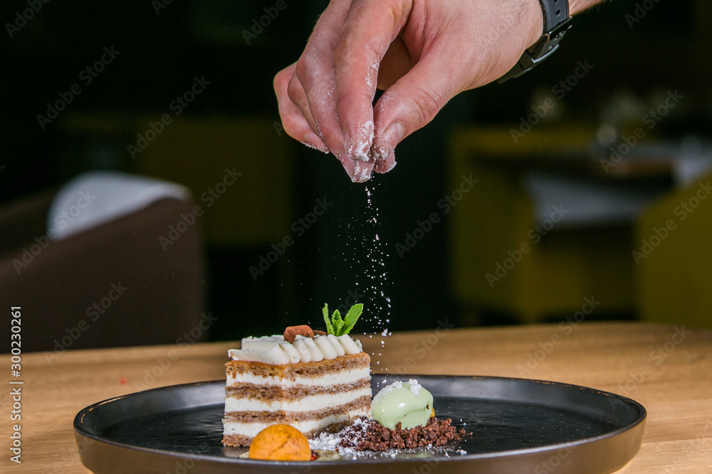 Close up hands of chef preparing sweet dessert. Cooking concept