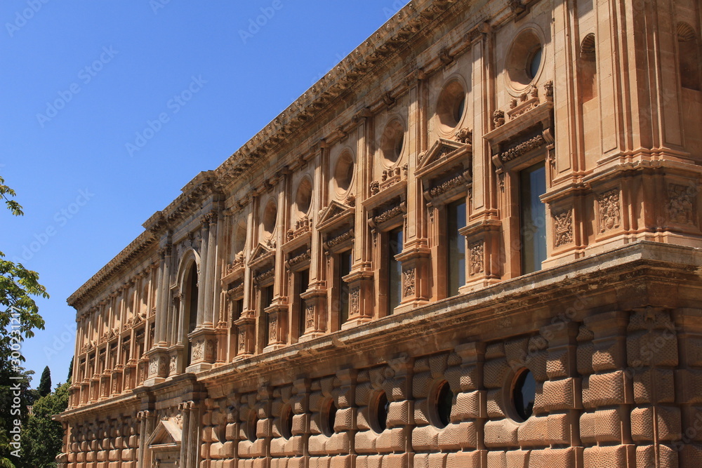 Exterior facade of historical Charles V Palace (Palacio de Carlos V) at the Alhambra Palace complex in Granada, Andalusia, Spain.