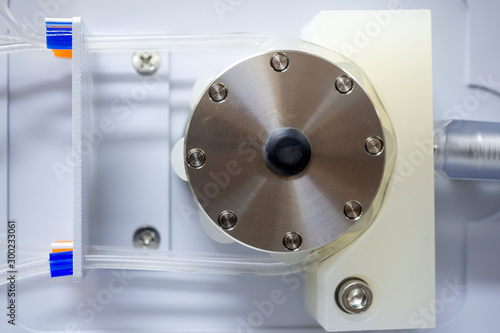 Peristaltic pump with plastic tubes. Without rollers moving. photo