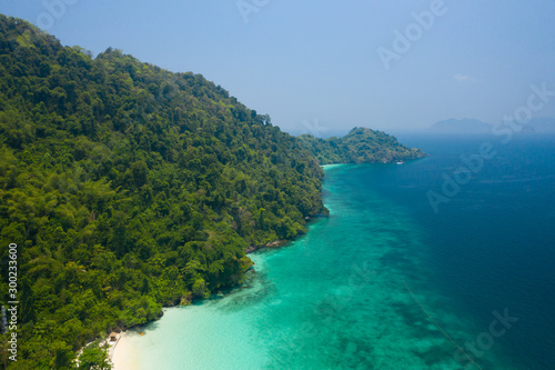 Aerial view from a drone of beautiful Nyaung Oo Phee island on sunny day in Myanmar.