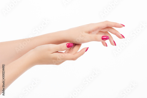 elegant female hands with red pink nails