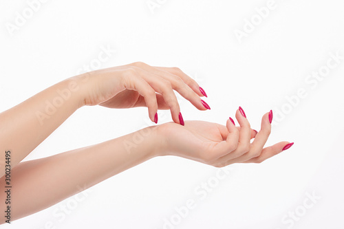 elegant female hands with red pink nails