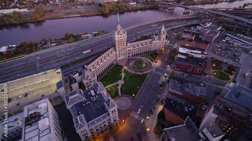 Albany New York Aerial v20 Panning birdseye detail over historical landmark building at dusk with Hudson river view - October 2017