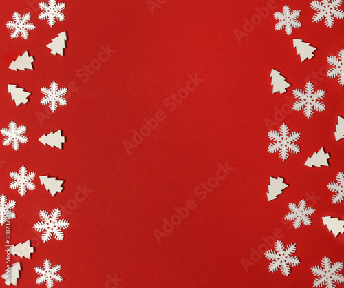 White christmas ornaments on festive red background with copy space  top view. Christmas  winter holiday  new year concept. 