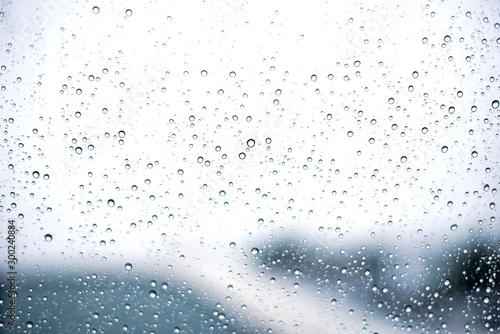 Abstract water droplets on the glass background