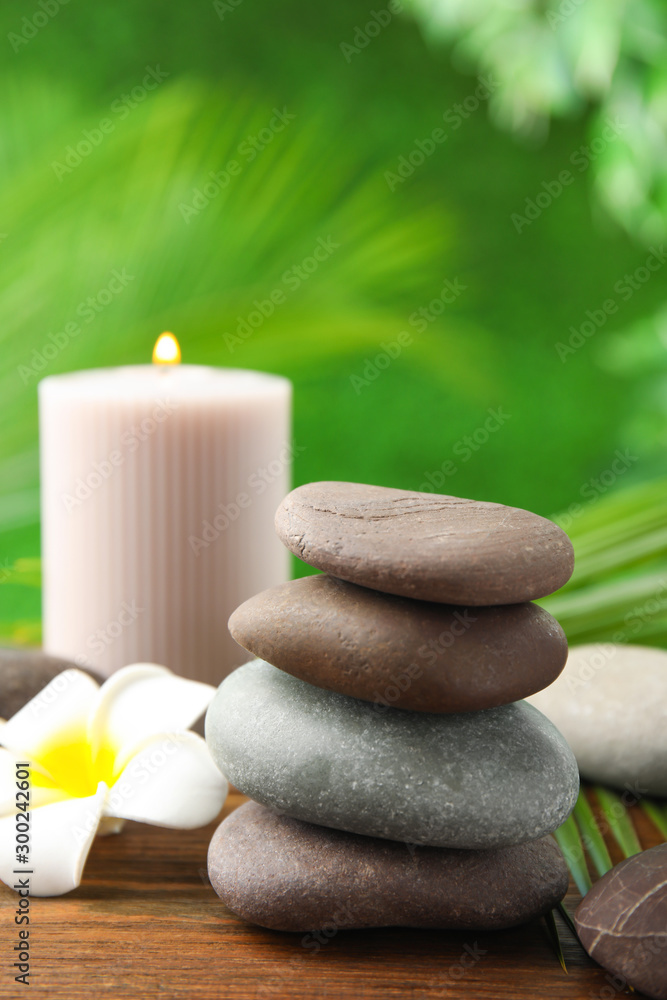 Composition with stones on table against blurred background. Zen concept