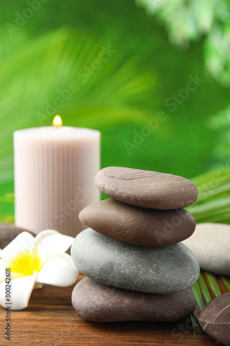 Composition with stones on table against blurred background. Zen concept