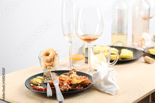 Food leftovers after party on wooden table