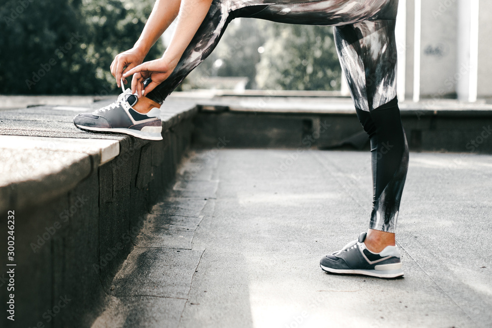 Beautiful sport fitness girl in sportswear doing fitness exercise in the street ,outdoor sports. Urban style. Beautiful sport fitness girl in sportswear doing fitness exercise in the street ,outdoor sports. Urban style.