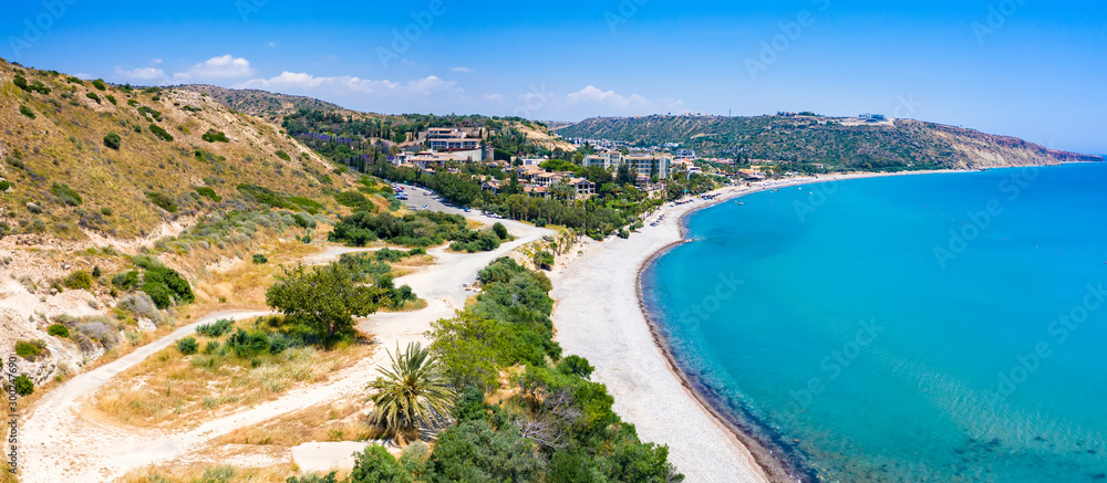 Pissouri. Cyprus. Pissouri beach panorama. Cyprus beaches aerial view. Resort hotels by the sea. Cruise to the island of Cyprus. Mediterranean coast. Hotels at the foot of the mountain.