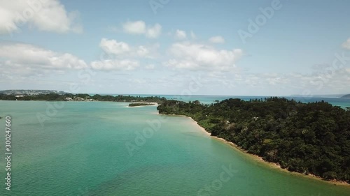 4K空撮動画　沖縄の美しいエメラルドグリーンの海と白い砂浜
4K aerial of flying over a beautiful Emerald green sea and white sand beach,  Haneji-Naikai Inland Sea, Okinawa, Japan photo