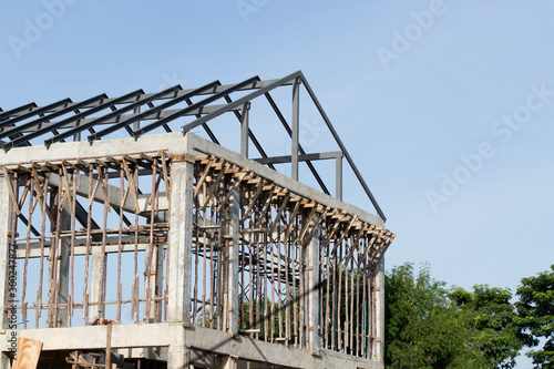Structure of house wait for complete builidng with blue sky background © bankrx
