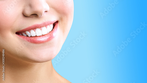 Perfect healthy teeth smile of a young woman. Teeth whitening. Dental clinic patient. Image symbolizes oral care dentistry  stomatology.