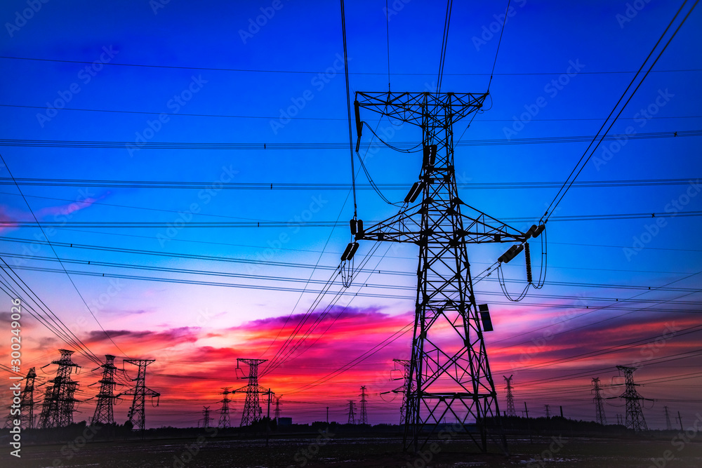 Fototapeta premium Contour of Transmission Tower at Sunset