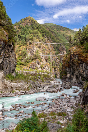 Suspention bridge on the Everest Base Camp Trek, Himalaya mountains, Sagarmatha National Park, Nepal.