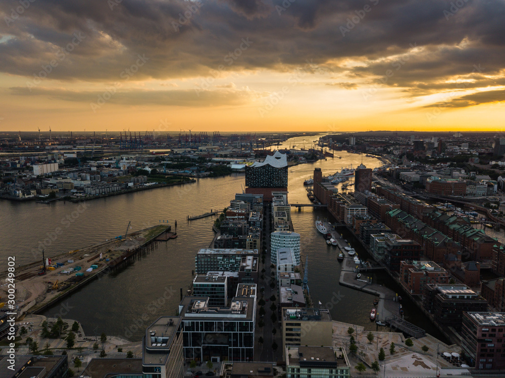 Fototapeta Aerial view of the Elbe River and the Opera House in Hamburg during sunset. Geramania in the summer