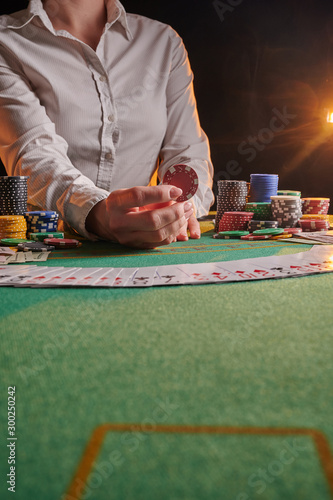 Photography croupier raises bets with chips