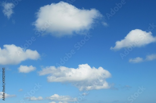 Blue sky with fluffy clouds, natural background © natalya2015