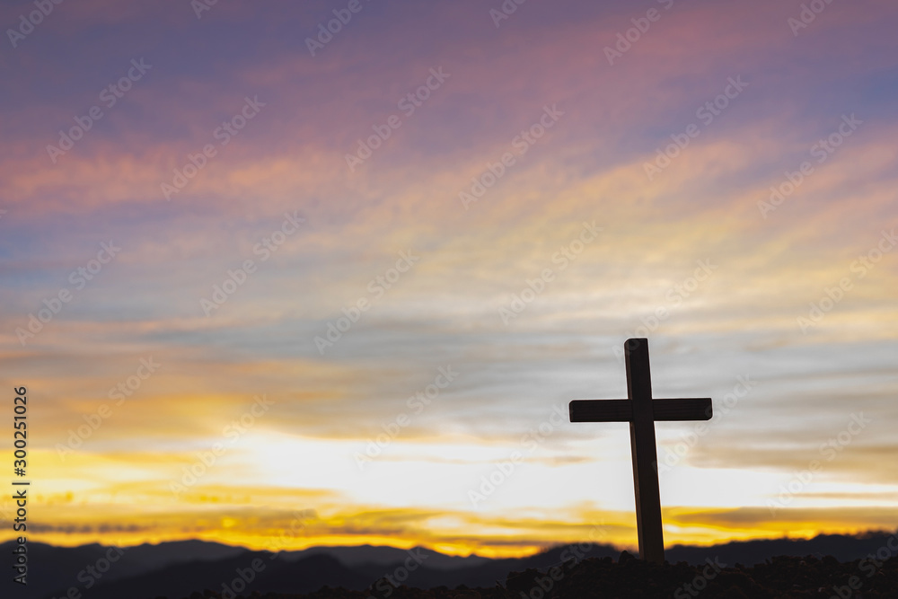Silhouette cross on mountain at sunset background.Crucifixion Of Jesus Christ