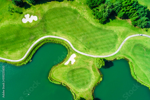 Aerial view of golf course and water photo