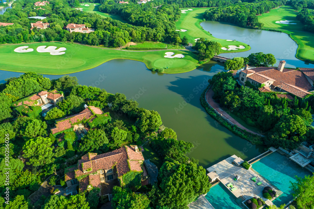 Aerial view of a beautiful green golf course.high angle view. Aerial view of a beautiful green golf course.high angle view.