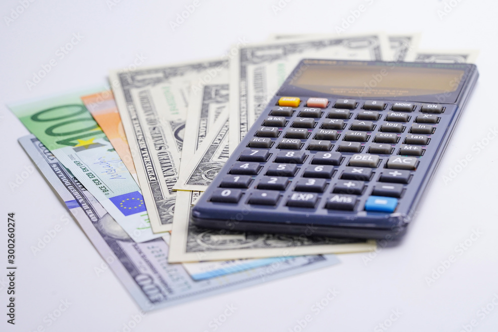 Calculator on chart and graph spreadsheet paper. Finance development, Banking Account, Statistics, Investment Analytic research data economy, Stock exchange trading, Business company concept.. Calculator on chart and graph spreadsheet paper. Finance development, Banking Account, Statistics, Investment Analytic research data economy, Stock exchange trading, Business company concept..