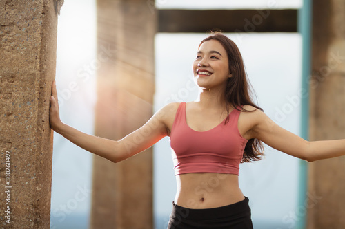 Asia woman do exercise with fun and happy on holiday Free Download Asia woman do exercise with fun and happy on holiday - GFXLoad