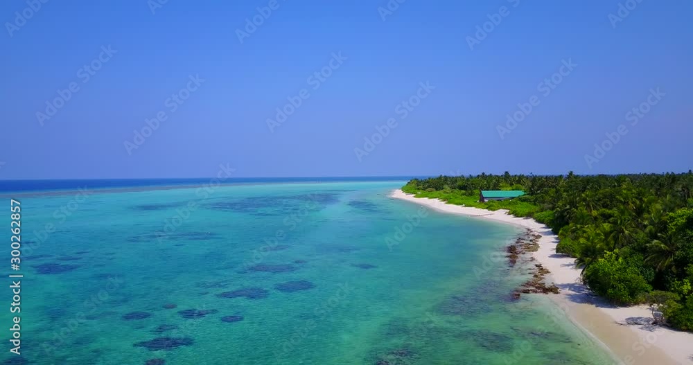 Tropical white sand beach and dense palm trees forest washed by turquoise clear sea water in Philippines Tropical white sand beach and dense palm trees forest washed by turquoise clear sea water in Philippines