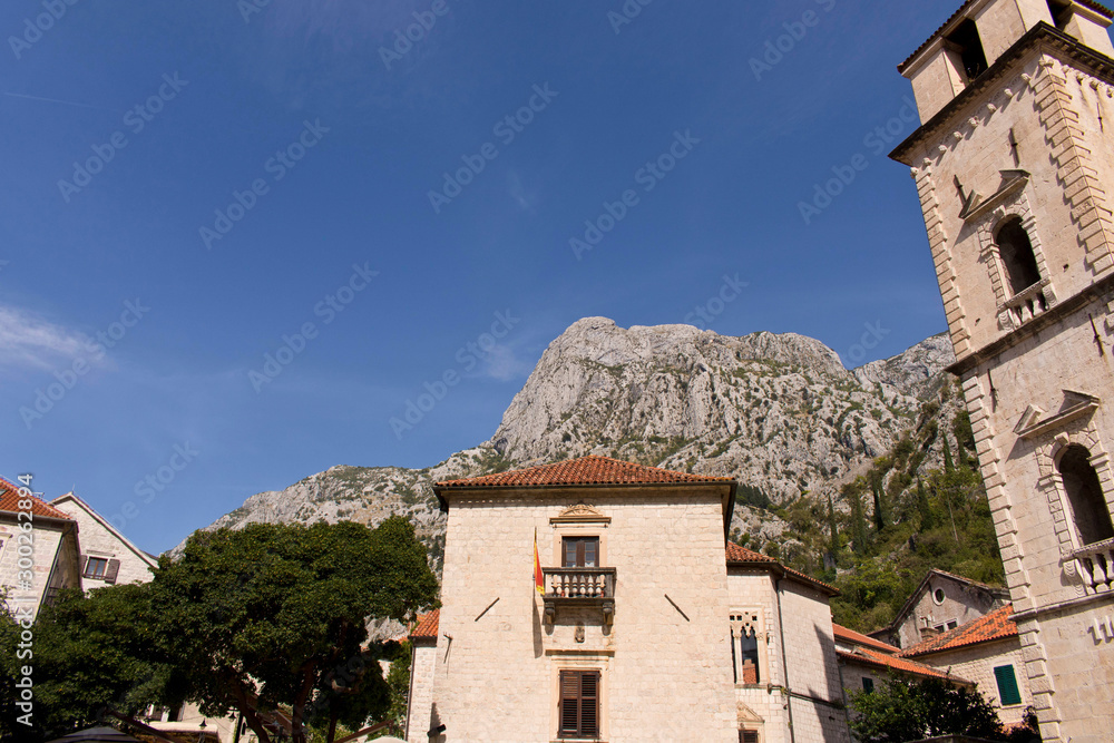 The building in the old town on the background of blue sky. Cator. Old town. Montenegro.
