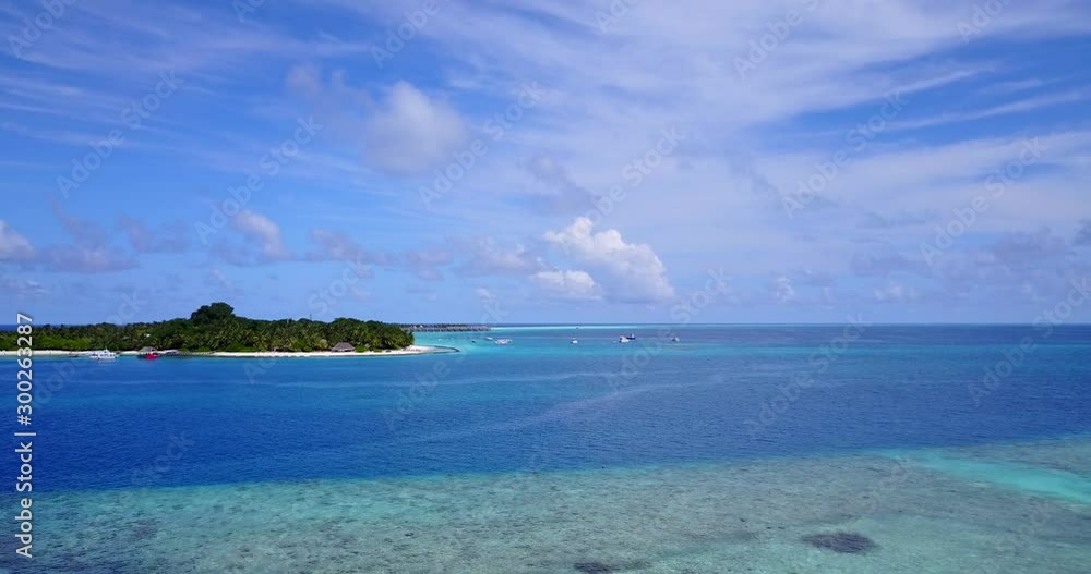 Stunning cloudy sky of tropic over endless ocean surrounding remote exotic island in Malaysia Stunning cloudy sky of tropic over endless ocean surrounding remote exotic island in Malaysia