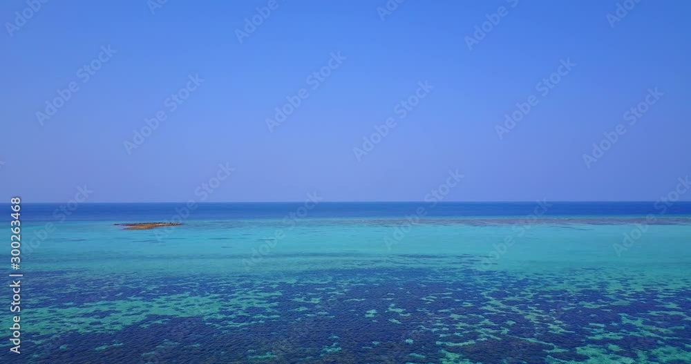 Copy space with coral reefs on shallow lagoon with a violet blue sky background in Australia Copy space with coral reefs on shallow lagoon with a violet blue sky background in Australia