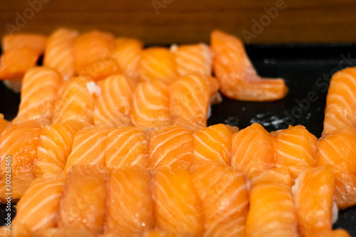 Group of fresh japanese salmon sushi.