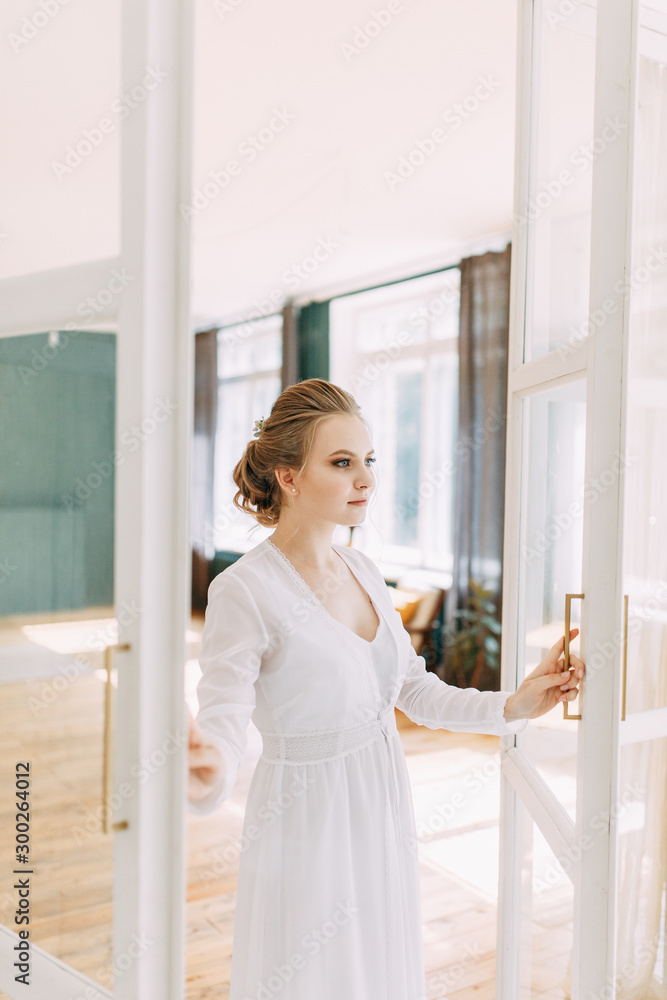 Girl in boudoir dress in European style. Morning bride in the interior Studio.