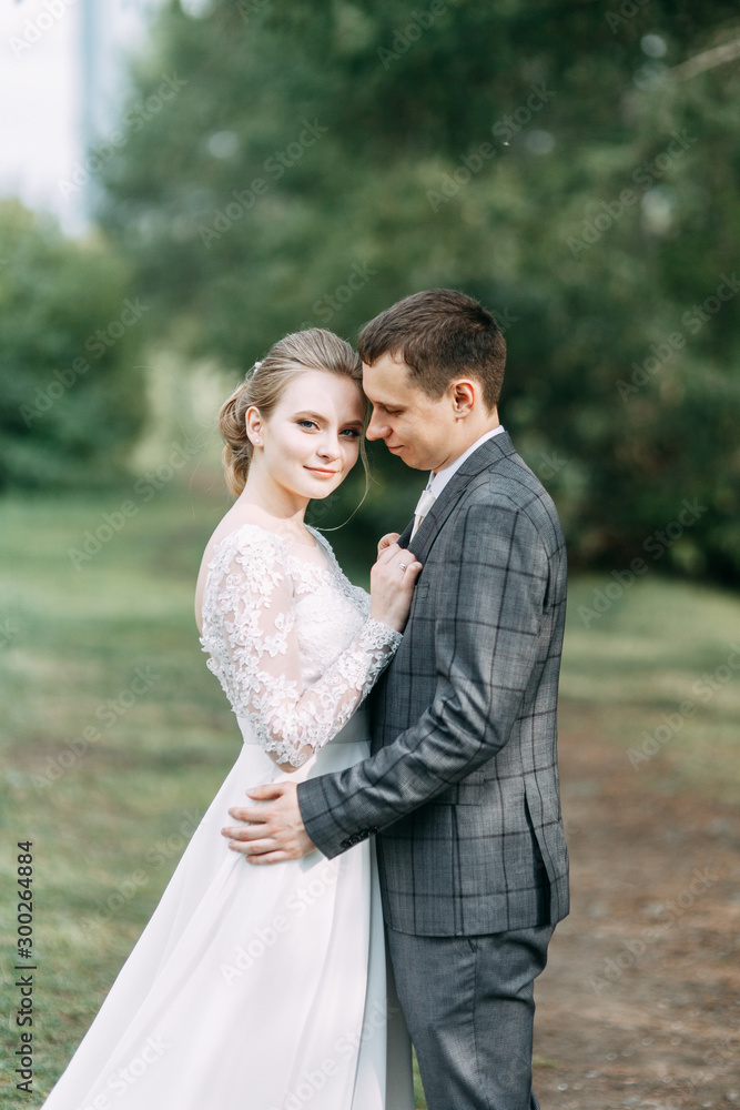 Modern ceremony in European style. Beautiful wedding couple in atmospheric forest with rocks. Modern ceremony in European style. Beautiful wedding couple in atmospheric forest with rocks.