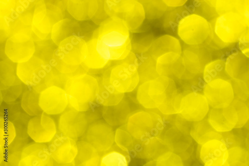 Golden glitter festive background with bokeh lights. Celebration concept for New Year, Christmas Holidays. © flying creature