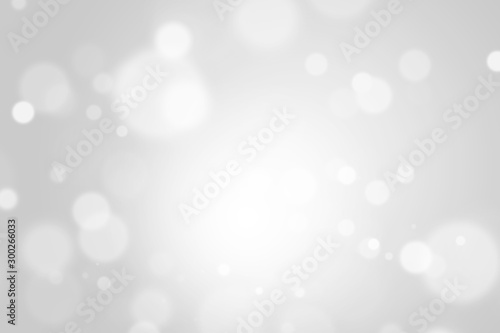 Bokeh abstract blurred gray and white beautiful background. Soft color light glitter sparkles. element for backdrop or design cosmetic ads, winter, christmas, luxury, beauty, baby, modern, creative