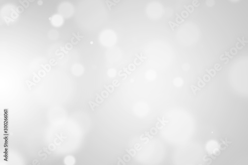 Bokeh abstract blurred gray and white beautiful background. Soft color light glitter sparkles. element for backdrop or design cosmetic ads, winter, christmas, luxury, beauty, baby, modern, creative