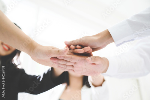 Business team teamwork join hands partnership concept