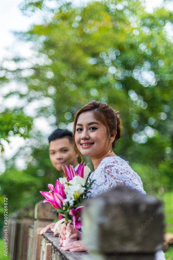 Asian loving couple pre-wedding outdoor photo shoot. Casual natural real people portraits. Loving romantic couple. Asian loving couple pre-wedding outdoor photo shoot. Casual natural real people portraits. Loving romantic couple.