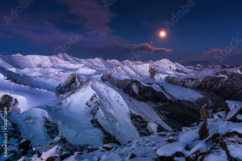 Fotografie Tien Shan mountains in moonlight before sunrise