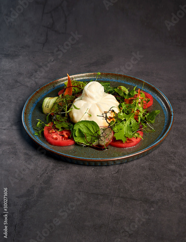 salad with burato cheese and herbs photo