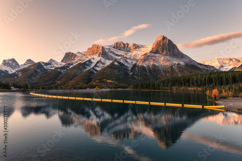Mount Lawrence Grassi in Canadian Rockies reflection on reservoir in the morning at Rundle Forebay photo