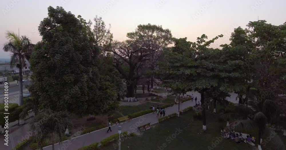 Main Square of Yapacani, Surrounded by Trees, with Many People Walking Around Main Square of Yapacani, Surrounded by Trees, with Many People Walking Around