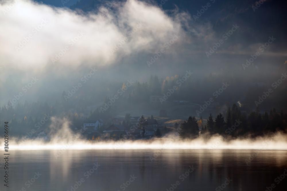 Lovely autumnal landscape with fog over the lake. Lovely autumnal landscape with fog over the lake.