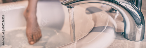 Photography Faucet with running water woman taking a bath in hotel bathub luxury wellness concept background panorama