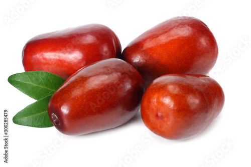 fresh date fruit with leaves isolated on white background.
