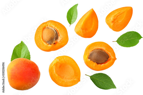 apricot fruits with slices and green leaf isolated on white background Fototapeta
