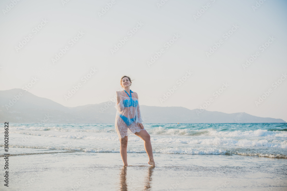 Sensually plus size cute woman on a beach, concept of modern lady lifestyle