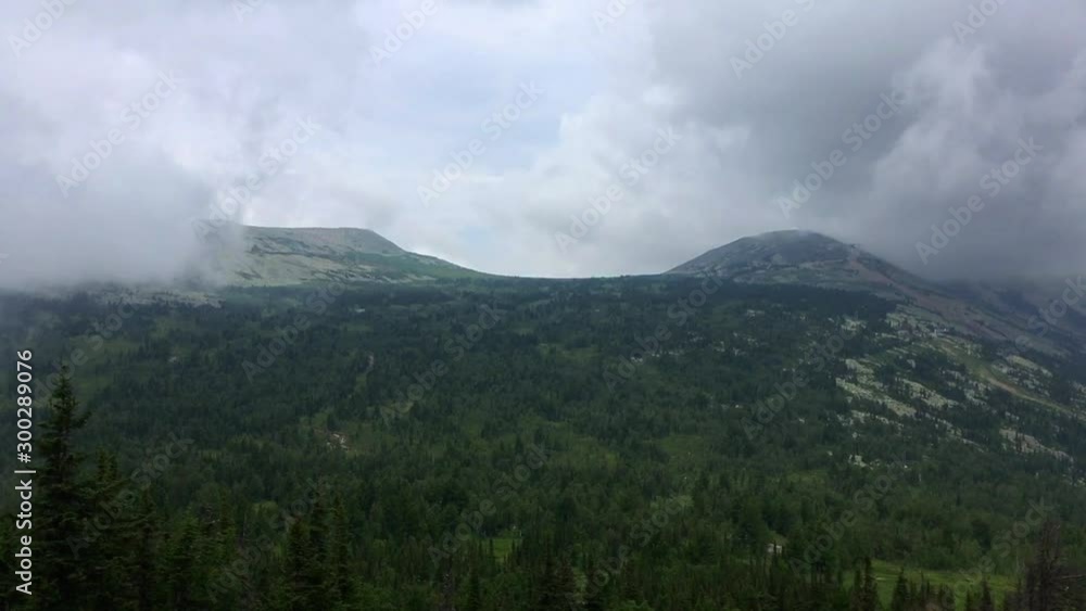Moving heavy rain cloud in a mountain forest Moving heavy rain cloud in a mountain forest