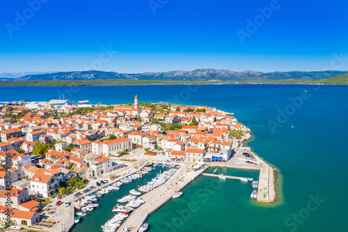 Croatia, Island of Murter, beautiful old traditional coastal town of Betina on Adriatic sea, drone aerial